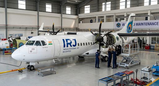 ALTIS IRJ undergoing maintenance in a hangar with ground crew